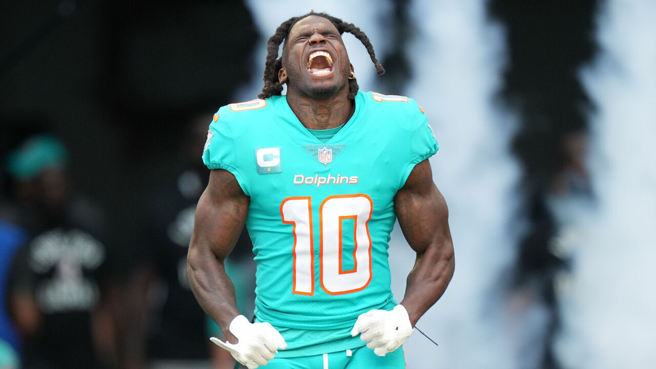 MIAMI GARDENS, FL - JANUARY 08: Miami Dolphins wide receiver Tyreek Hill (10) tries to excite the crowd during pregame introductions before the game between the New York Jets and the Miami Dolphins on Sunday, January 8, 2023 at Hard Rock Stadium, Miami Gardens, Fla.
