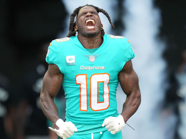 MIAMI GARDENS, FL - JANUARY 08: Miami Dolphins wide receiver Tyreek Hill (10) tries to excite the crowd during pregame introductions before the game between the New York Jets and the Miami Dolphins on Sunday, January 8, 2023 at Hard Rock Stadium, Miami Gardens, Fla.