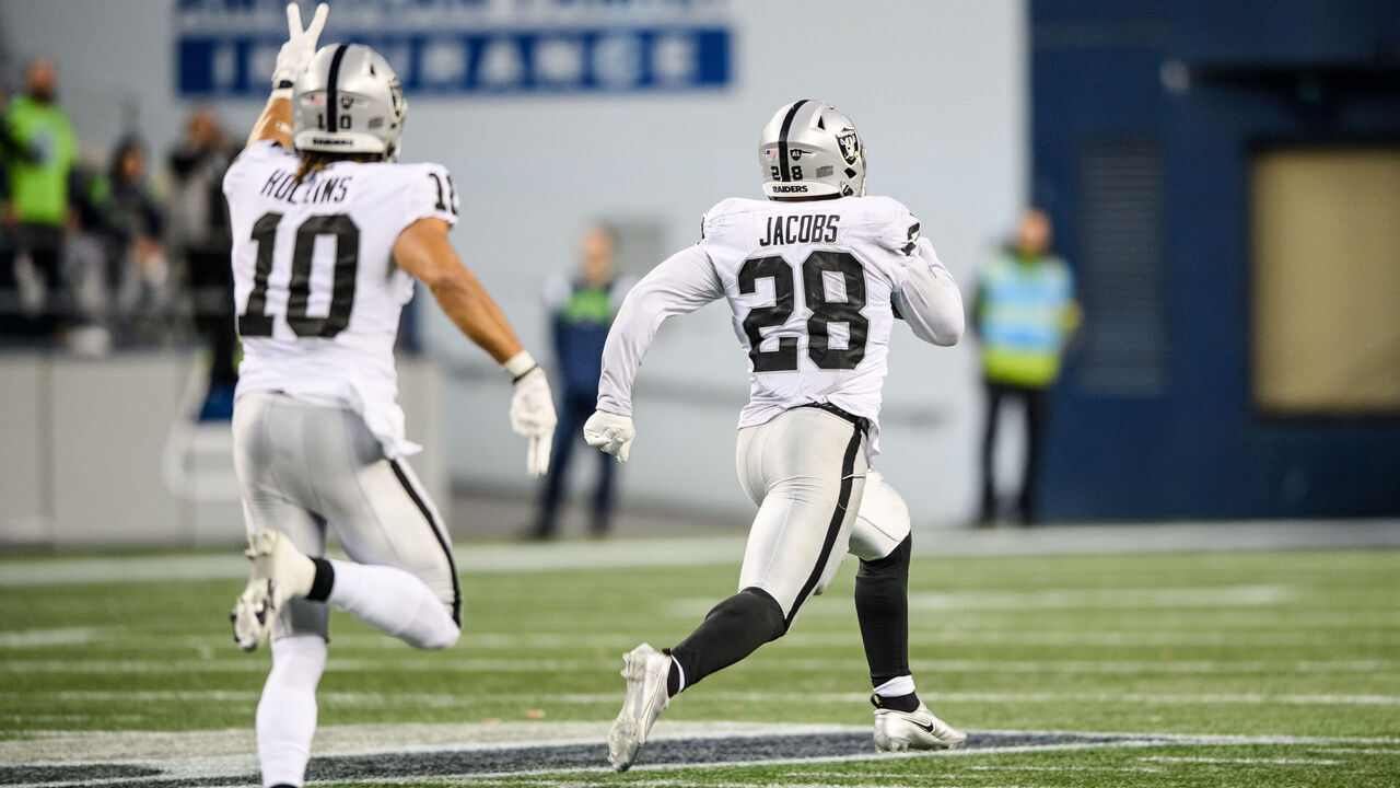 SEATTLE, WASHINGTON - NOVEMBER 27: Josh Jacobs #28 of the Las Vegas Raiders carries the ball for a touchdown in overtime to beat the Seattle Seahawks 40-34 at Lumen Field on November 27, 2022 in Seattle, Washington.
