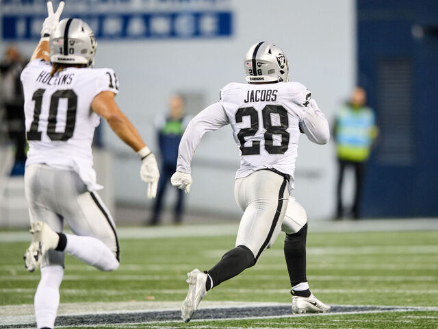 SEATTLE, WASHINGTON - NOVEMBER 27: Josh Jacobs #28 of the Las Vegas Raiders carries the ball for a touchdown in overtime to beat the Seattle Seahawks 40-34 at Lumen Field on November 27, 2022 in Seattle, Washington.