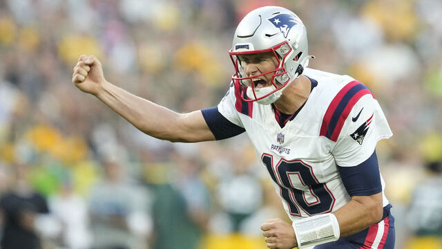 GREEN BAY, WISCONSIN - AUGUST 19: Mac Jones #10 of the New England Patriots celebrates after a touchdown in the first quarter against the Green Bay Packers during a preseason game at Lambeau Field on August 19, 2023 in Green Bay, Wisconsin.