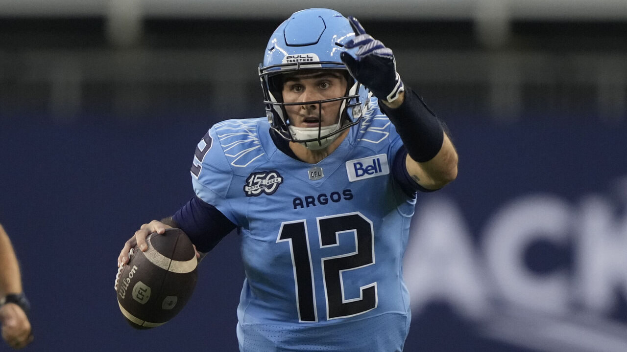 TORONTO, CANADA - AUGUST 25: Chad Kelly #12 of the Toronto Argonauts gestures to his receivers as he rolls out to pass against the Calgary Stampeders at BMO Field on August 25, 2023 in Toronto, Canada.