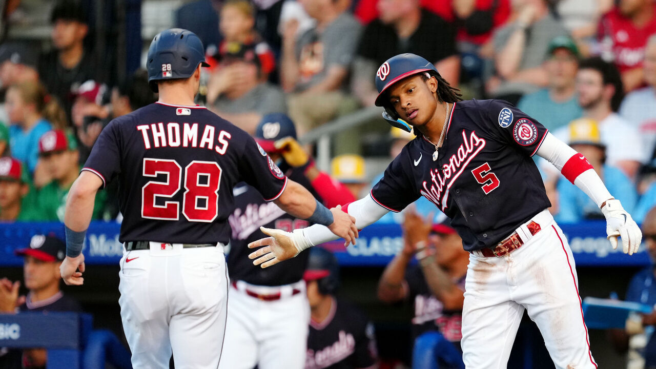 WILLIAMSPORT PA, - AUGUST 20: Lane Thomas #28 of the Washington Nationals is greeted by teammate CJ Abrams #5 after scoring a run during the 2023 Little League Classic between the Philadelphia Phillies and the Washington Nationals at Muncy Bank Ballpark at Historic Bowman Field on Sunday, August 20, 2023 in Williamsport, Pennsylvania.