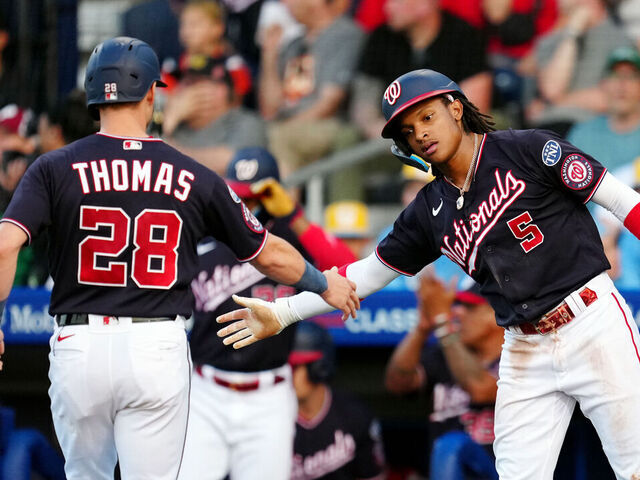 WILLIAMSPORT PA, - AUGUST 20: Lane Thomas #28 of the Washington Nationals is greeted by teammate CJ Abrams #5 after scoring a run during the 2023 Little League Classic between the Philadelphia Phillies and the Washington Nationals at Muncy Bank Ballpark at Historic Bowman Field on Sunday, August 20, 2023 in Williamsport, Pennsylvania.