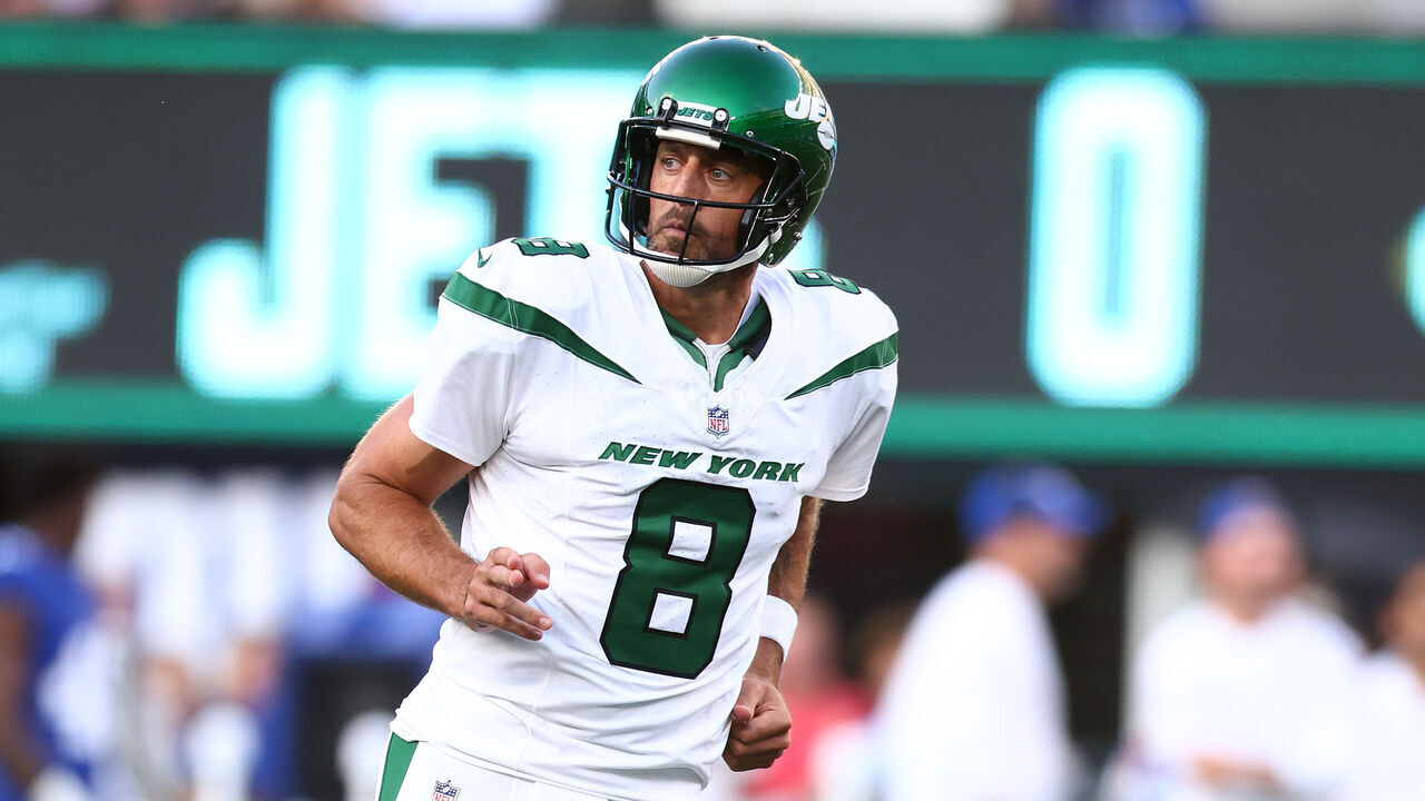 EAST RUTHERFORD, NEW JERSEY - AUGUST 26: Aaron Rodgers #8 of the New York Jets reacts after throwing a first quarter touchdown pass to Garrett Wilson #17 in a preseason game against the New York Giants at MetLife Stadium on August 26, 2023 in East Rutherford, New Jersey.