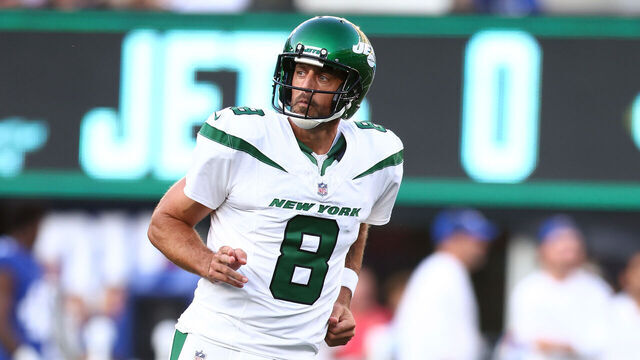 EAST RUTHERFORD, NEW JERSEY - AUGUST 26: Aaron Rodgers #8 of the New York Jets reacts after throwing a first quarter touchdown pass to Garrett Wilson #17 in a preseason game against the New York Giants at MetLife Stadium on August 26, 2023 in East Rutherford, New Jersey.