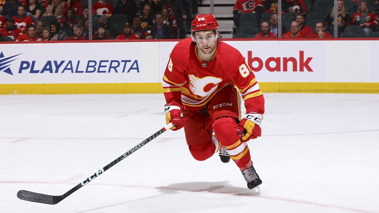 CALGARY, AB - APRIL 10: Andrew Mangiapane #88 of the Calgary Flames skates up ice against the Nashville Predators at Scotiabank Saddledome on April 10, 2023 in Calgary, Alberta, Canada.