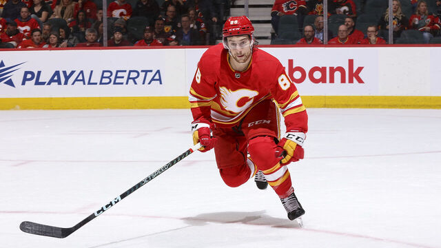 CALGARY, AB - APRIL 10: Andrew Mangiapane #88 of the Calgary Flames skates up ice against the Nashville Predators at Scotiabank Saddledome on April 10, 2023 in Calgary, Alberta, Canada.
