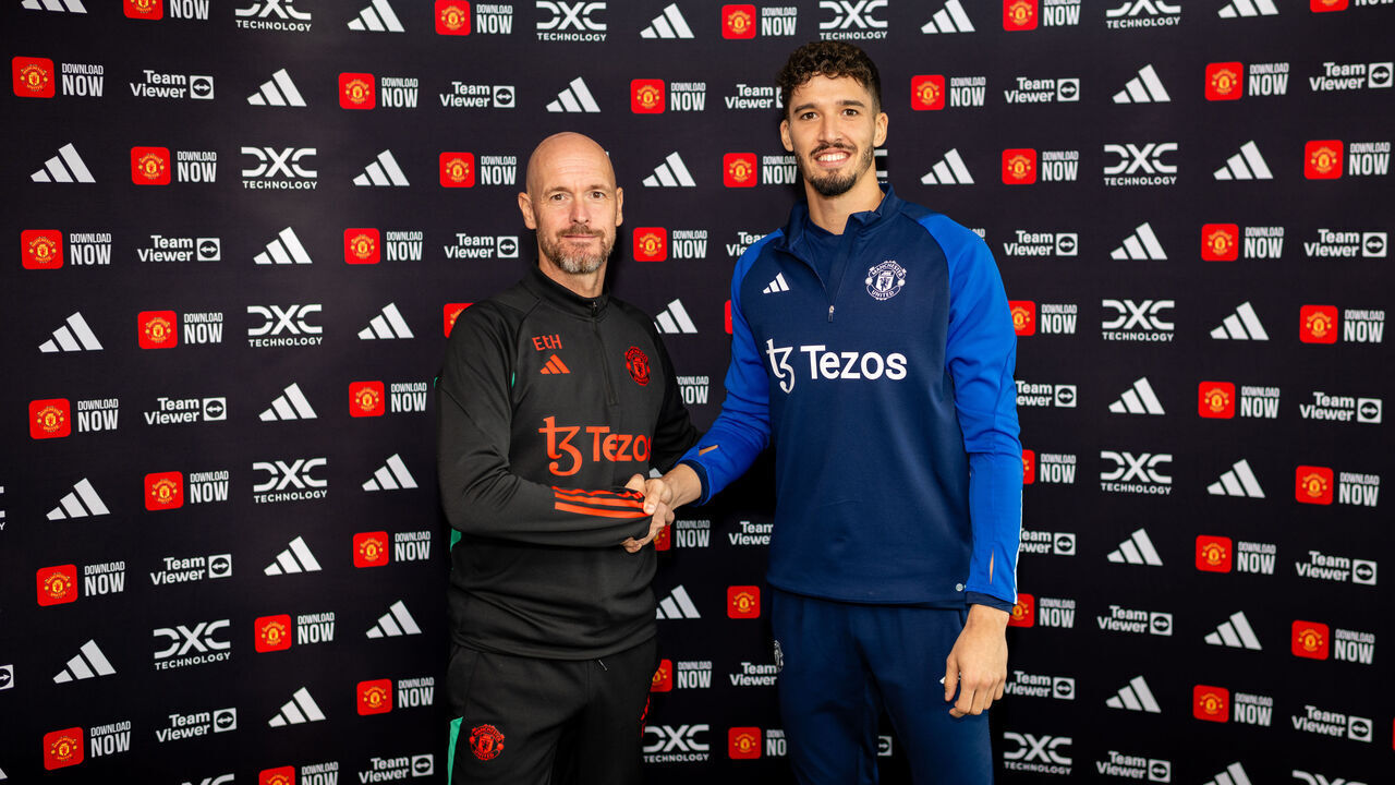 MANCHESTER, ENGLAND - SEPTEMBER 1: (EXCLUSIVE COVERAGE) Altay Bayindir of Manchester United poses with Manager Erik ten Hag after signing for the club at Carrington Training Ground on September 1, 2023 in Manchester, England.