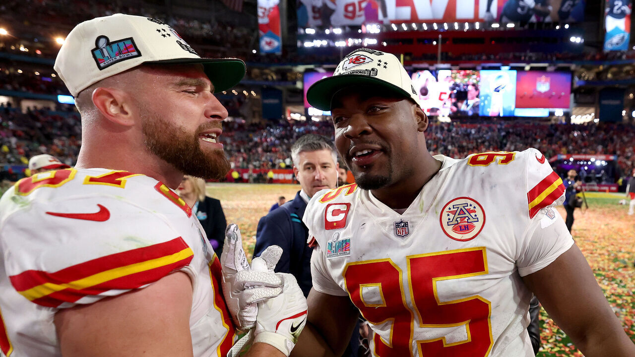GLENDALE, ARIZONA - FEBRUARY 12: Travis Kelce #87 and Chris Jones #95 of the Kansas City Chiefs celebrate after defeating the Philadelphia Eagles 38-35 in Super Bowl LVII at State Farm Stadium on February 12, 2023 in Glendale, Arizona.