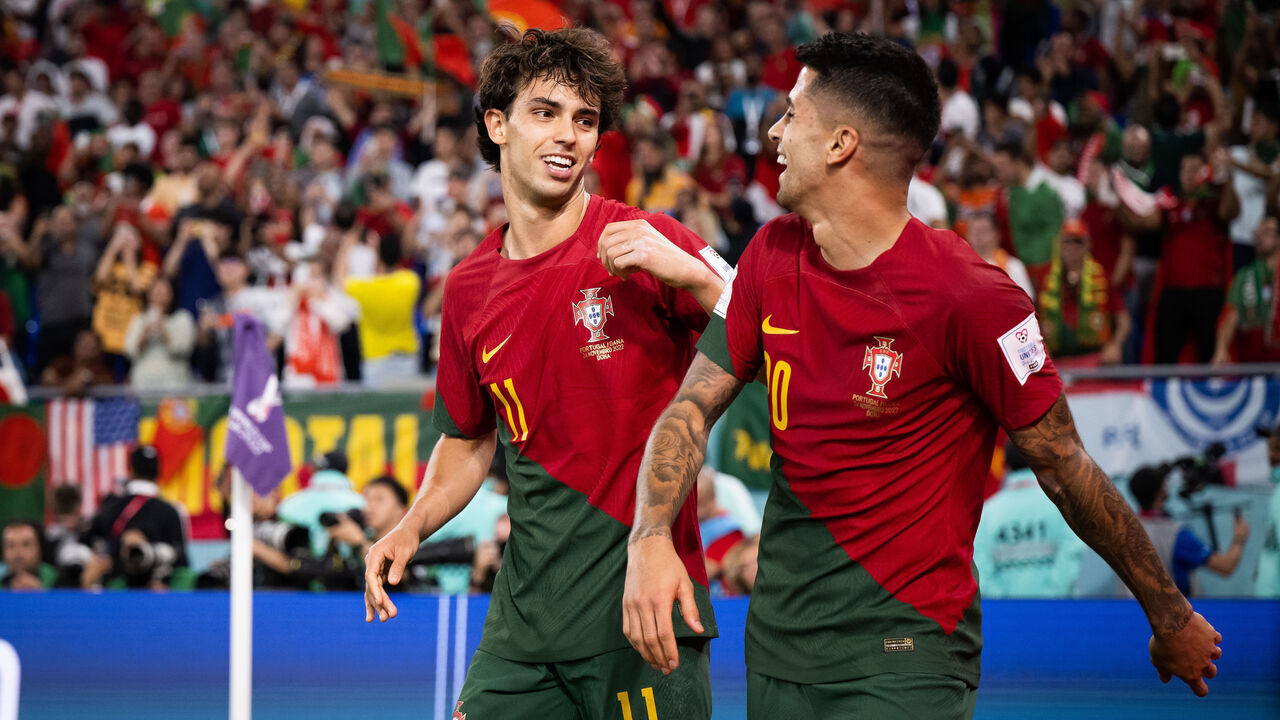 DOHA, QATAR - NOVEMBER 24: Joao Felix (L) of Portugal celebrates with Joao Cancelo (R) of Portugal after scoring his team's second goal during the FIFA World Cup Qatar 2022 Group H match between Portugal and Ghana at Stadium 974 on November 24, 2022 in Doha, Qatar.
