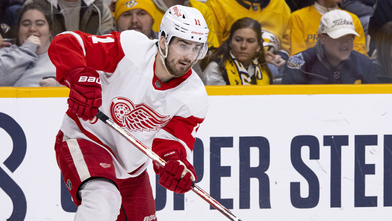 NASHVILLE, TN - MARCH 14: Filip Zadina #11 of the Detroit Red Wings passes the puck during the first period against the Nashville Predators at Bridgestone Arena on March 14, 2023 in Nashville, Tennessee.