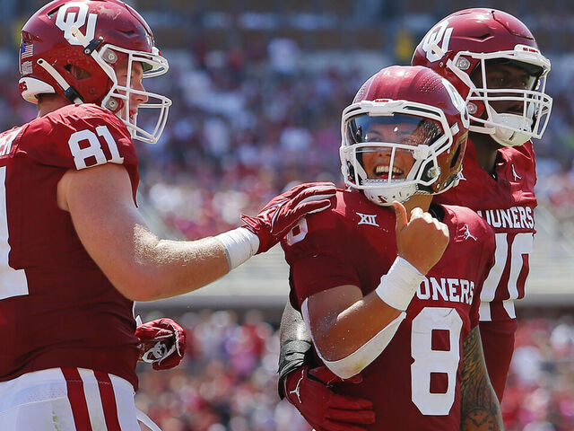 NORMAN, OKLAHOMA - SEPTEMBER 2: Tight end Austin Stogner #81 congratulates quarterback Dillon Gabriel #8 of the Oklahoma Sooners on his 5-yard touchdown run against the Arkansas State Red Wolves in the second quarter at Gaylord Family Oklahoma Memorial Stadium on September 2, 2023 in Norman, Oklahoma. Oklahoma leads 45-0 at the half.