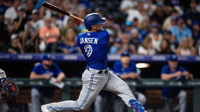 DENVER, CO - SEPTEMBER 1: Danny Jansen #9 of the Toronto Blue Jays hits a two-run home run in the sixth inning against the Colorado Rockies at Coors Field on September 1, 2023 in Denver, Colorado.