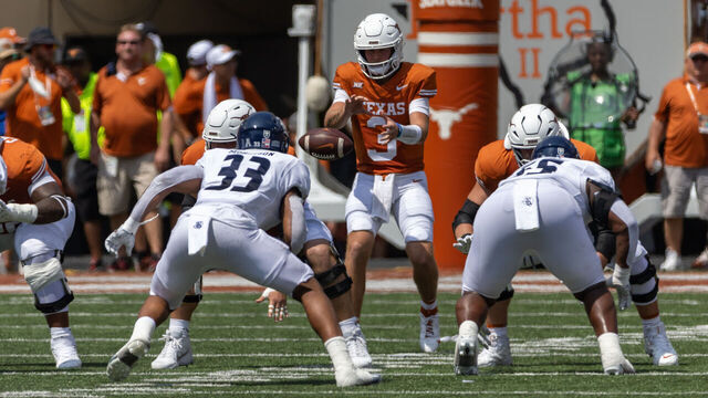 AUSTIN, TX - SEPTEMBER 02: Texas Longhorns quarterback Quinn Ewers (3) takes a snap during the college football game between Texas Longhorns and Rice Owls on September 2, 2023, at Darrell K Royal-Texas Memorial Stadium in Austin, TX.