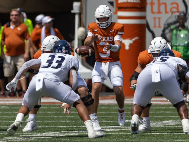 AUSTIN, TX - SEPTEMBER 02: Texas Longhorns quarterback Quinn Ewers (3) takes a snap during the college football game between Texas Longhorns and Rice Owls on September 2, 2023, at Darrell K Royal-Texas Memorial Stadium in Austin, TX.