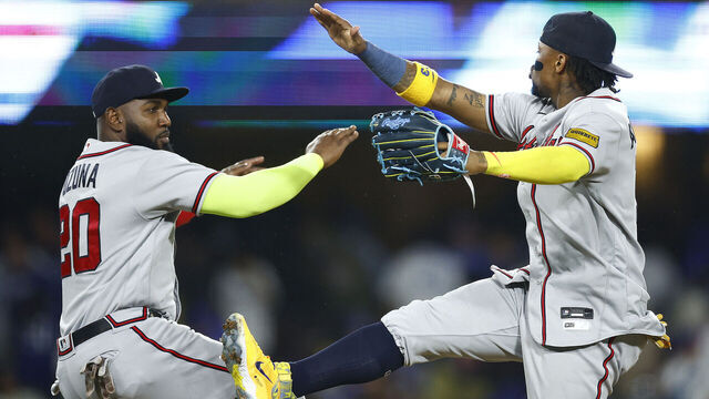 LOS ANGELES, CALIFORNIA - SEPTEMBER 02: Marcell Ozuna #20 and Ronald Acuna Jr. #13 of the Atlanta Braves celebrate a 4-2 win against the Los Angeles Dodgers at Dodger Stadium on September 02, 2023 in Los Angeles, California.