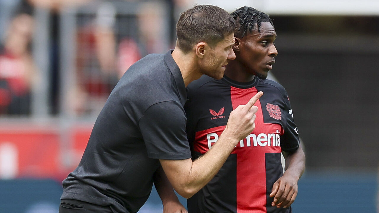 LEVERKUSEN, GERMANY - AUGUST 5: head coach Xabi Alonso of Bayer 04 Leverkusen and Jeremie Frimpong of Bayer 04 Leverkusen talk together during the pre-season friendly match between Bayer 04 Leverkusen and West Ham United at BayArena on August 5, 2023 in Leverkusen, Germany.