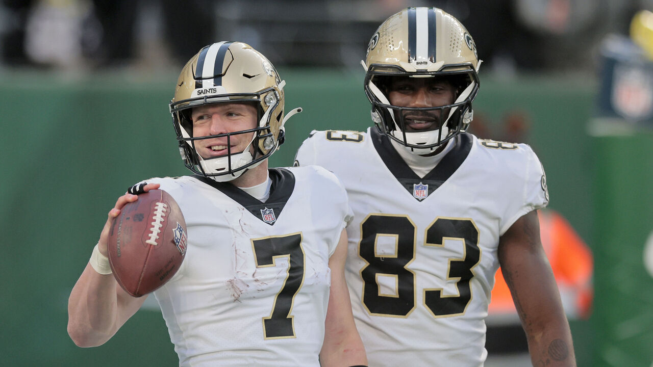 EAST RUTHERFORD, NEW JERSEY - DECEMBER 12: (NEW YORK DAILIES OUT) Taysom Hill #7 of the New Orleans Saints celebrates his fourth quarter touchdown run against the New York Jets with teammate Juwan Johnson #83 at MetLife Stadium on December 12, 2021 in East Rutherford, New Jersey. The Saints defeated the Giants 30-9.