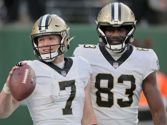 EAST RUTHERFORD, NEW JERSEY - DECEMBER 12: (NEW YORK DAILIES OUT) Taysom Hill #7 of the New Orleans Saints celebrates his fourth quarter touchdown run against the New York Jets with teammate Juwan Johnson #83 at MetLife Stadium on December 12, 2021 in East Rutherford, New Jersey. The Saints defeated the Giants 30-9.