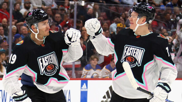 SUNRISE, FLORIDA - FEBRUARY 04: Brady Tkachuk of the Ottawa Senators (R) congratulates his brother Matthew Tkachuk of the Florida Panthers (L) on his goal during the 2023 NHL All-Star Game at FLA Live Arena on February 04, 2023 in Sunrise, Florida.
