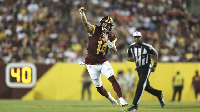 LANDOVER, MARYLAND - AUGUST 21: Sam Howell #14 of the Washington Commanders passes on the run \av during an NFL preseason game at FedExField on August 21, 2023 in Landover, Maryland.