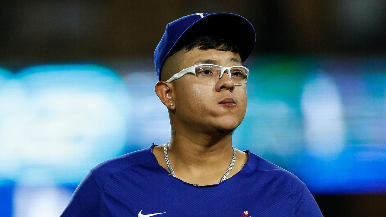 LOS ANGELES, CALIFORNIA - AUGUST 30: Julio Urias #7 of the Los Angeles Dodgers walks off the field after a team victory over the Arizona Diamondbacks at Dodger Stadium on August 30, 2023 in Los Angeles, California.