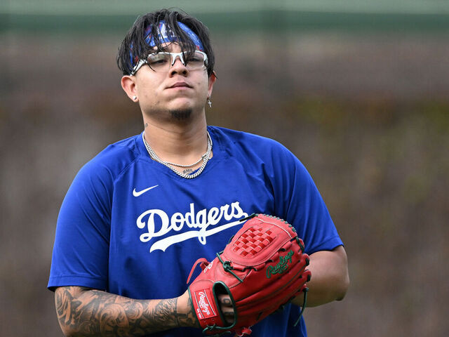 CHICAGO, ILLINOIS - APRIL 20: Julio Urias #7 of the Los Angeles Dodgers warms up before the game against the Los Angeles Dodgers at Wrigley Field on April 20, 2023 in Chicago, Illinois.