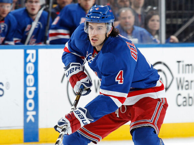 NEW YORK, NY - DECEMBER 20: Michael Del Zotto #4 of the New York Rangers skates against the New York Islanders at Madison Square Garden on December 20, 2013 in New York City. The New York Islanders won 5-3.