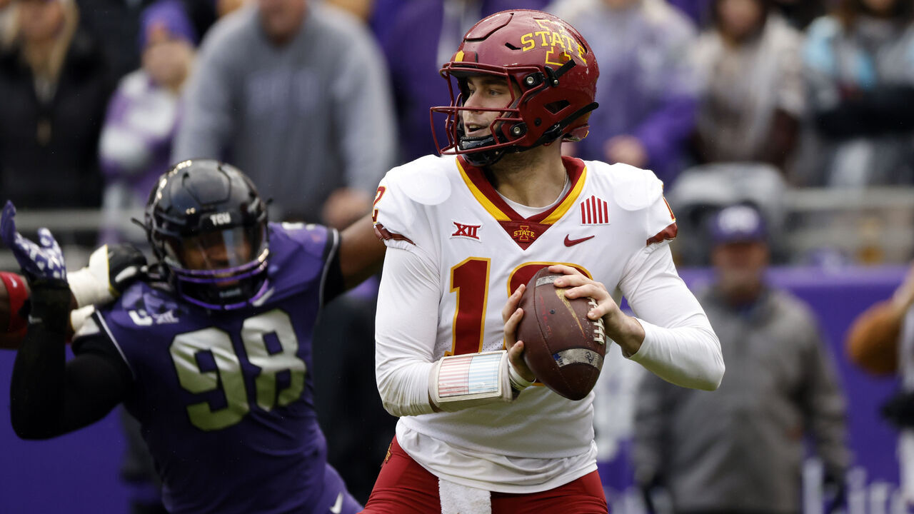 FORT WORTH, TX - NOVEMBER 26: quarterback Hunter Dekkers #12 of the Iowa State Cyclones looks to throw against the TCU Horned Frogs at Amon G. Carter Stadium on November 26, 2022 in Fort Worth, Texas.