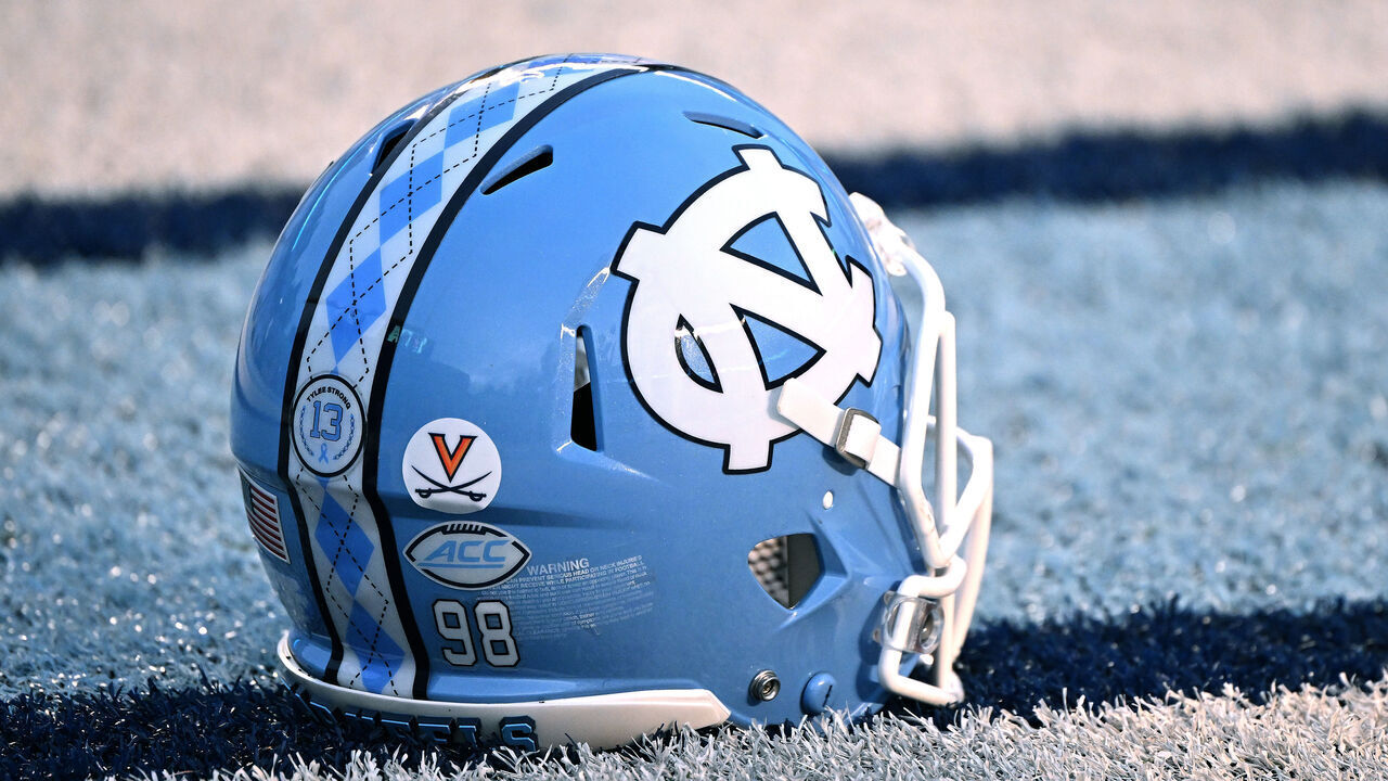 CHAPEL HILL, NORTH CAROLINA - NOVEMBER 19: A detailed view of a University of Virginia helmet sticker, in honor of the three Virginia football players who were killed in a shooting, is seen on the helmet of a North Carolina Tar Heels player during their game against the Georgia Tech Yellow Jackets at Kenan Memorial Stadium on November 19, 2022 in Chapel Hill, North Carolina.