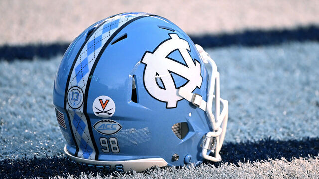 CHAPEL HILL, NORTH CAROLINA - NOVEMBER 19: A detailed view of a University of Virginia helmet sticker, in honor of the three Virginia football players who were killed in a shooting, is seen on the helmet of a North Carolina Tar Heels player during their game against the Georgia Tech Yellow Jackets at Kenan Memorial Stadium on November 19, 2022 in Chapel Hill, North Carolina.