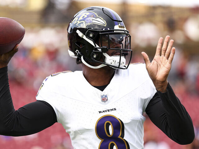 Lamar Jackson of the Baltimore Ravens warms up prior to an NFL