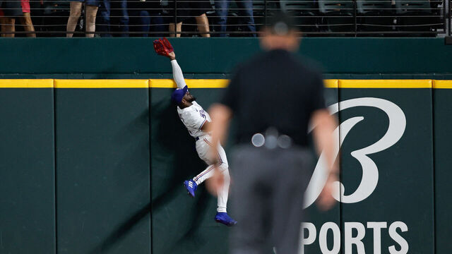 ARLINGTON, TX - SEPTEMBER 06: Adolis Garcia #53 of the Texas Rangers is unable to make a catch on a home run ball hit by Michael Brantley #23 of the Houston Astros in the second inning during the game between the Houston Astros and the Texas Rangers at Globe Life Field on Wednesday, September 6, 2023 in Arlington, Texas.