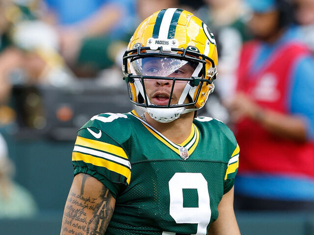 GREEN BAY, WISCONSIN - AUGUST 19: Christian Watson #9 of the Green Bay Packers warms up before the preseason game against the New England Patriots at Lambeau Field on August 19, 2023 in Green Bay, Wisconsin.