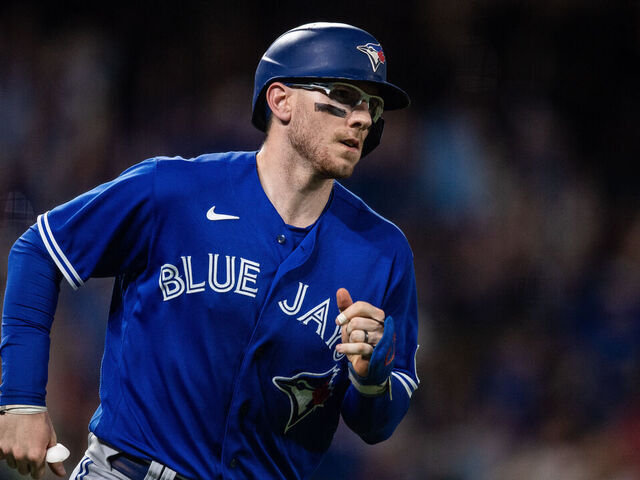 DENVER, CO - SEPTEMBER 1: Danny Jansen #9 of the Toronto Blue Jays runs after hitting a two run home run in the sixth inning against the Colorado Rockies at Coors Field on September 1, 2023 in Denver, Colorado.