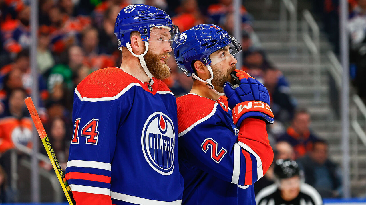 EDMONTON, AB - MARCH 16: Edmonton Oilers Defenceman Mattias Ekholm (14) and Edmonton Oilers Defenceman Evan Bouchard (2) talk about a play in the second period of the Edmonton Oilers game versus the Dallas Stars on March 16, 2023 at Rogers Place in Edmonton, AB.