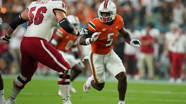 MIAMI GARDENS, FL - SEPTEMBER 01: Miami Hurricanes safety Kamren Kinchens (5) rushes the quarterback as Miami (Oh) Redhawks offensive lineman Reid Holskey (56) blocks during the game between the Miami (Ohio) Redhawks and the Miami (FL) Hurricanes on Friday, September 1, 2023 at Hard Rock Stadium, Miami Gardens, Fla.