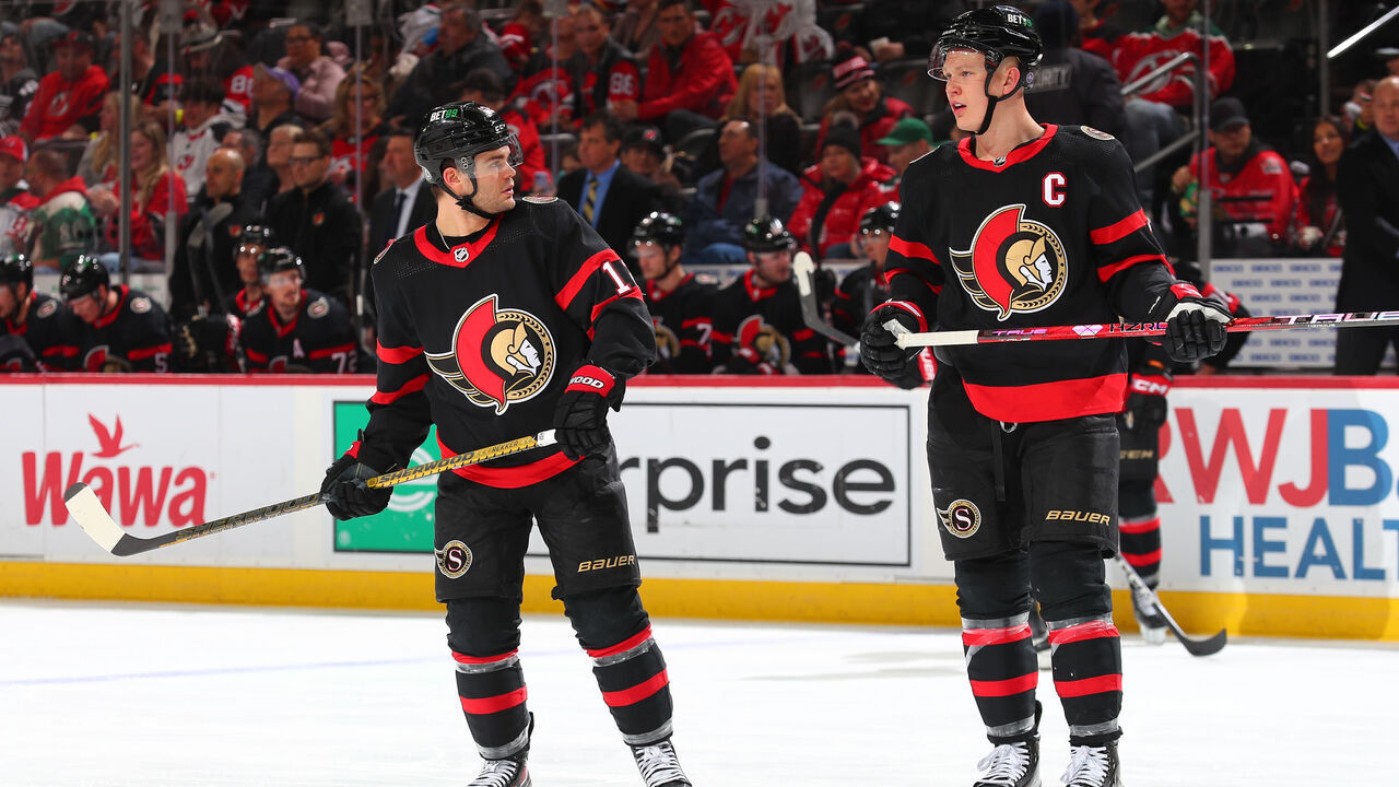 NEWARK, NJ - MARCH 25: Alex DeBrincat #12 of the Ottawa Senators and Brady Tkachuk #7 of the Ottawa Senators in the second period of the game against the New Jersey Devils at the Prudential Center on March 25, 2023 in Newark, New Jersey.