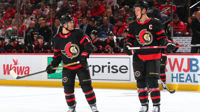 NEWARK, NJ - MARCH 25: Alex DeBrincat #12 of the Ottawa Senators and Brady Tkachuk #7 of the Ottawa Senators in the second period of the game against the New Jersey Devils at the Prudential Center on March 25, 2023 in Newark, New Jersey.