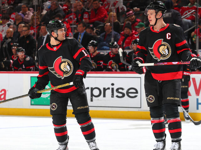 NEWARK, NJ - MARCH 25: Alex DeBrincat #12 of the Ottawa Senators and Brady Tkachuk #7 of the Ottawa Senators in the second period of the game against the New Jersey Devils at the Prudential Center on March 25, 2023 in Newark, New Jersey.