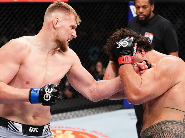 SYDNEY, AUSTRALIA - SEPTEMBER 10: (L-R) Alexander Volkov of Russia punches Tai Tuivasa of Australia in a heavyweight fight during the UFC 293 event at Qudos Bank Arena on September 10, 2023 in Sydney, Australia.