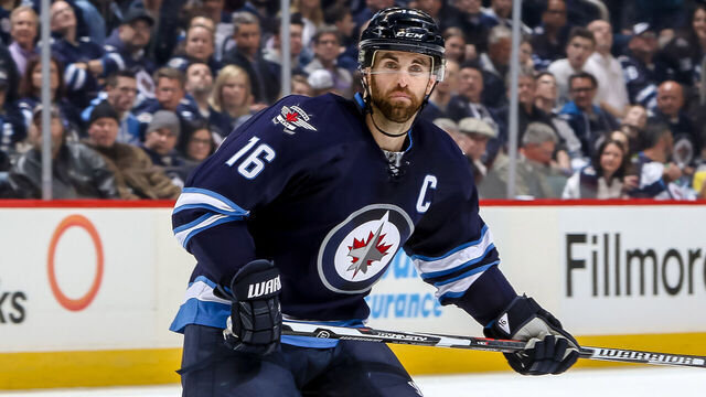 WINNIPEG, MB - FEBRUARY 23: Andrew Ladd #16 of the Winnipeg Jets keeps an eye on the play during second period action against the Dallas Stars at the MTS Centre on February 23, 2016 in Winnipeg, Manitoba, Canada. The Stars defeated the Jets 5-3.