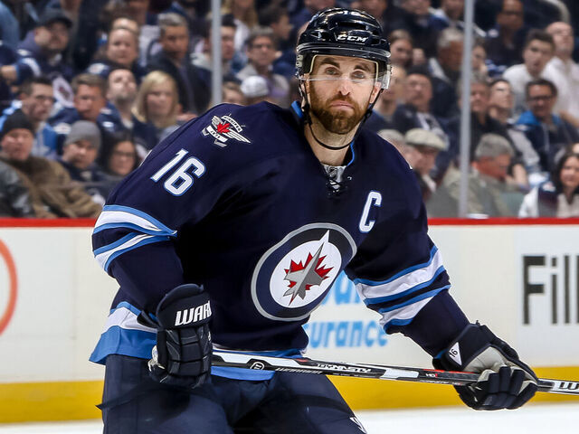 WINNIPEG, MB - FEBRUARY 23: Andrew Ladd #16 of the Winnipeg Jets keeps an eye on the play during second period action against the Dallas Stars at the MTS Centre on February 23, 2016 in Winnipeg, Manitoba, Canada. The Stars defeated the Jets 5-3.