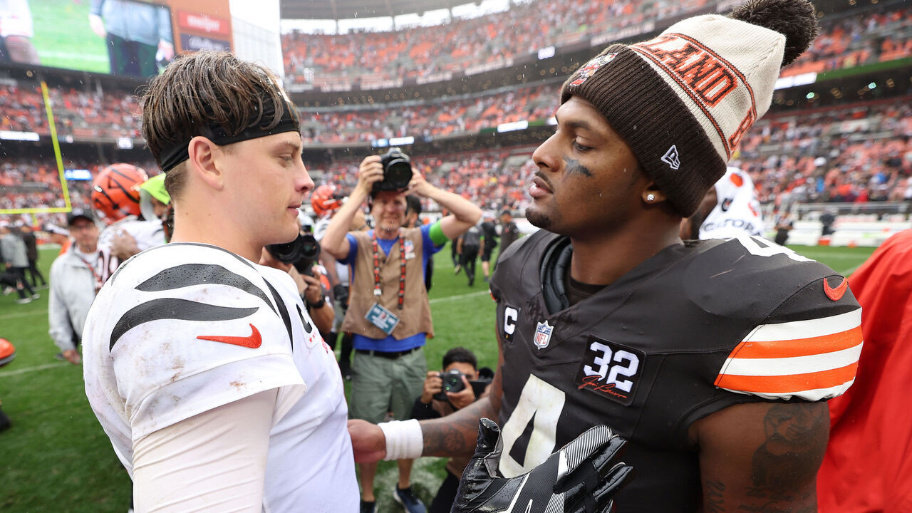 CLEVELAND, OHIO - SEPTEMBER 10: Joe Burrow #9 of the Cincinnati Bengals and Deshaun Watson #4 of the Cleveland Browns meet on the field following the Browns 24-3 win at Cleveland Browns Stadium on September 10, 2023 in Cleveland, Ohio.