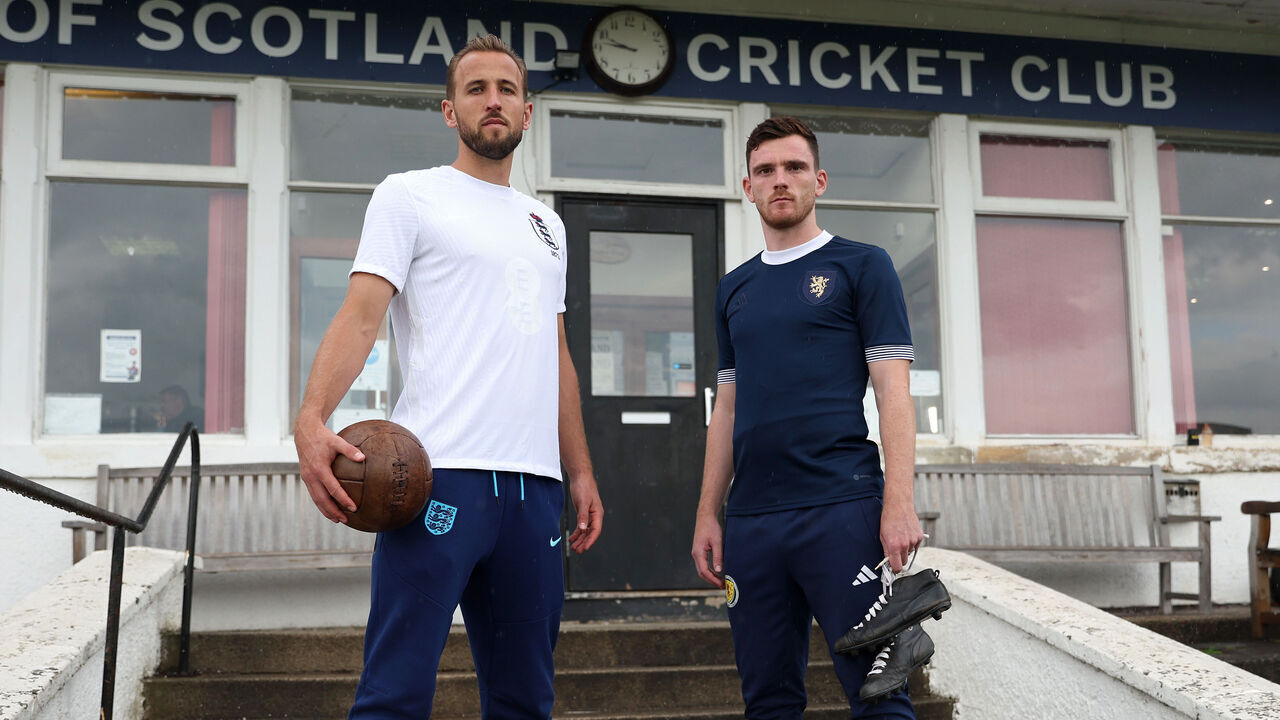 MILNGAVIE, SCOTLAND - SEPTEMBER 10: Harry Kane of England and Andy Robertson of Scotland pose for a photo wearing unique warm-up shirts ahead of the 150th Anniversary Heritage Match between England and Scotland at Hampden Park, at McCrea West of Scotland Cricket Club on September 10, 2023 in Milngavie, Scotland.