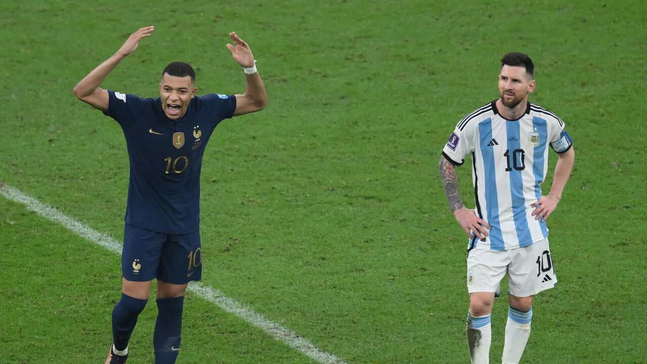 LUSAIL CITY, QATAR - DECEMBER 18: Kylian Mbappe of France (L) and Lionel Messi of Argentina during the FIFA World Cup Qatar 2022 Final match between Argentina and France at Lusail Stadium on December 18, 2022 in Lusail City, Qatar.