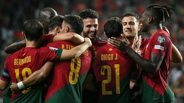 Portugal's forward #21 Diogo Jota celebrates with teammates after scoring a goal during the EURO 2024 first round group J qualifying football match between Portugal and Luxembourg at the Algarve stadium in Almancil, Faro district, on September 11, 2023.