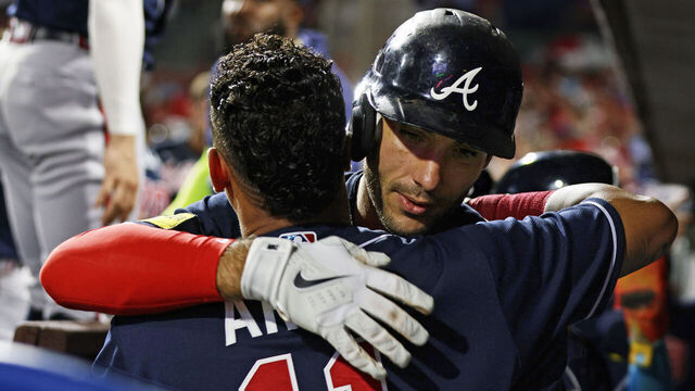 PHILADELPHIA, PENNSYLVANIA - SEPTEMBER 11: Matt Olson #28 of the Atlanta Braves is hugged by Orlando Arcia #11 after hitting a three-run home run against the Philadelphia Phillies during the third of game two of a doubleheader at Citizens Bank Park on September 11, 2023 in Philadelphia, Pennsylvania.