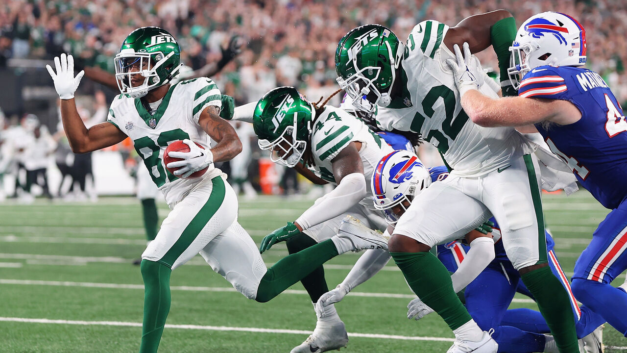 EAST RUTHERFORD, NEW JERSEY - SEPTEMBER 11: Wide receiver Xavier Gipson #82 of the New York Jets scores the game winning touchdown on a 65-yard punt return during the overtime quarter of the NFL game against the Buffalo Bills at MetLife Stadium on September 11, 2023 in East Rutherford, New Jersey.